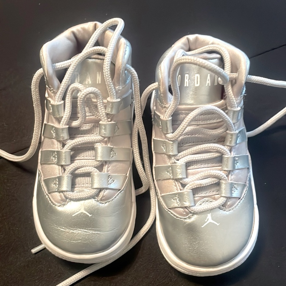 Baby girl size 5c silver metallic Jordans worn twice.